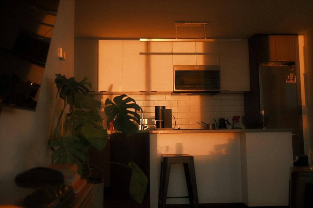 small kitchen mini bar counter warm Edison bulb rental apartment interior