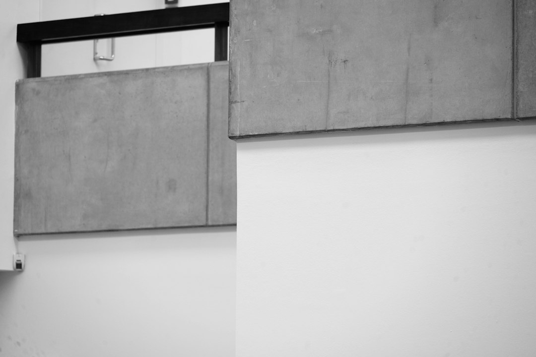 minimalist coffee shop interior concrete wall soft lighting