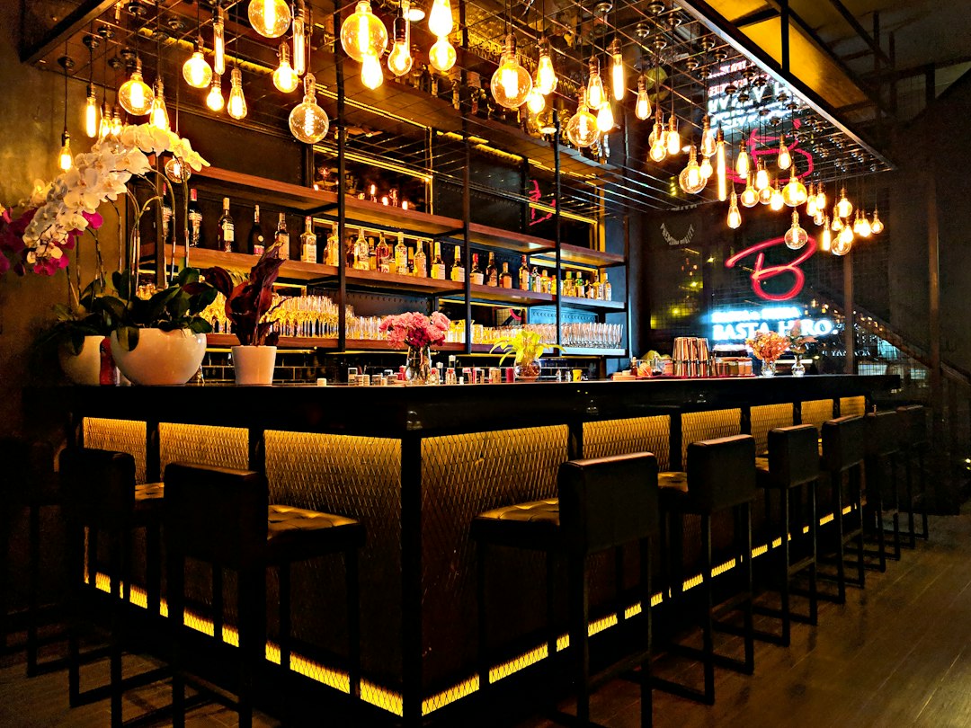 multi-use restaurant bar space dramatic evening lighting