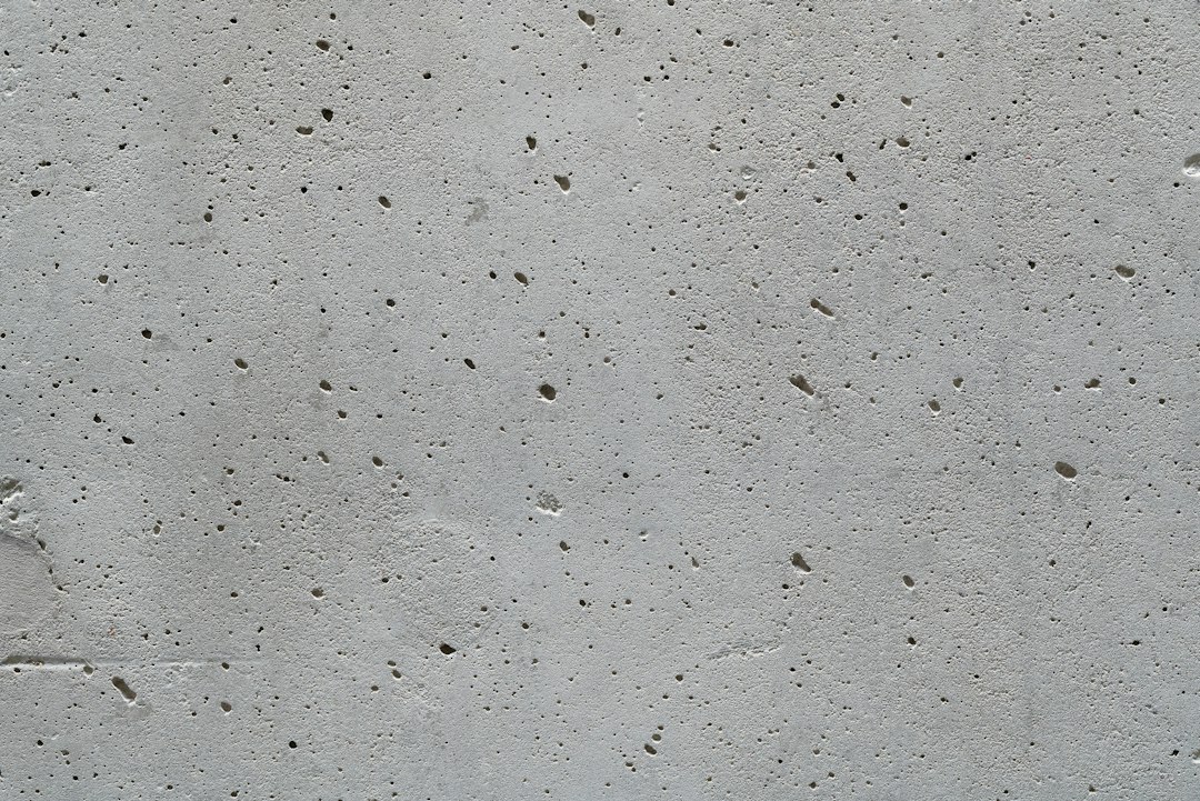 raw concrete cafe interior textured wall natural light