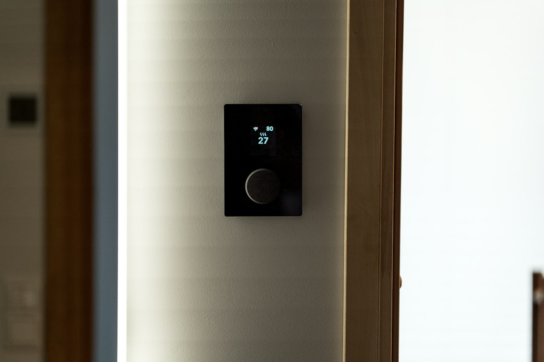 smart home control panel hidden behind mirror dark interior