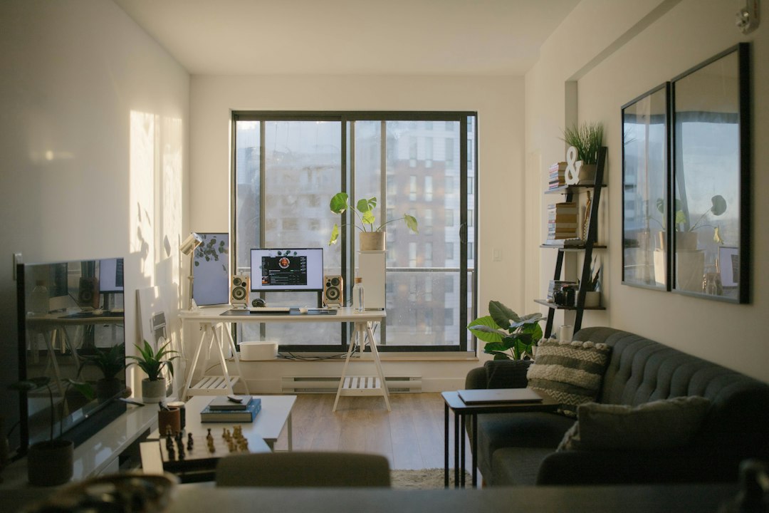 cinematic furnished apartment interior warm amber lighting dramatic shadow depth